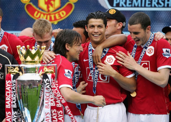 MANCHESTER, UNITED KINGDOM - MAY 13:  Gabriel Heinze (L), Cristiano Ronaldo and John O'Shea of Manchester United celebrate winning the Premiership title at the end of the Barclays Premiership match between Manchester United and West Ham United at Old Trafford on May 13, 2007 in Manchester, England.  (Photo by Alex Livesey/Getty Images)