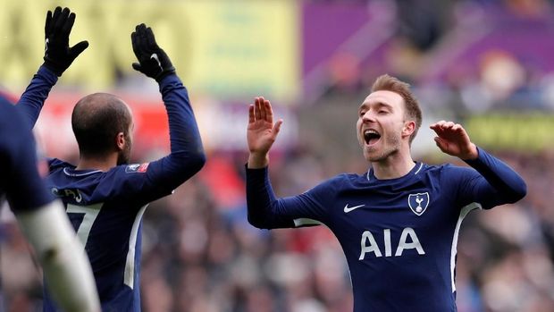 Christian Eriksen mencetak dua gol ke gawang Swansea City.