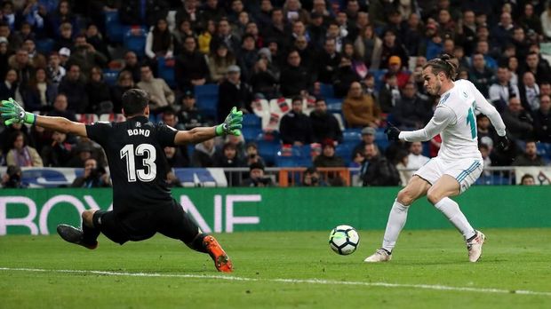 Gareth Bale mencetak satu gol ke gawang Girona dalam pertandingan Senin (19/3).