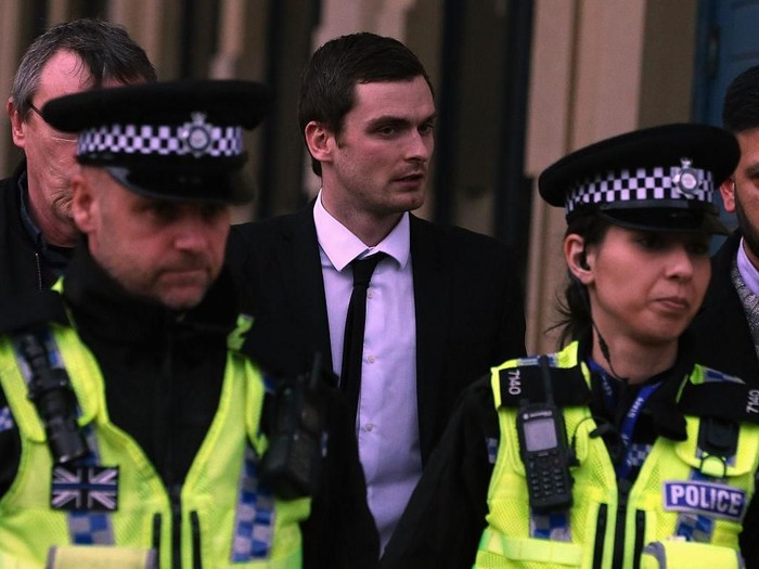 BRADFORD, ENGLAND - MARCH 01:  Footballer Adam Johnson (C) leaves Bradford Crown Court during day thirteen of the trial where he is facing child sexual assault charges on March 1, 2016 in Bradford, England. The former Sunderland FC midfielder, 28, from Castle Eden, County Durham, has admitted one charge of sexual activity with a child and one charge of child grooming, but denies two further counts of sexual activity with a child.  (Photo by Nigel Roddis/Getty Images)