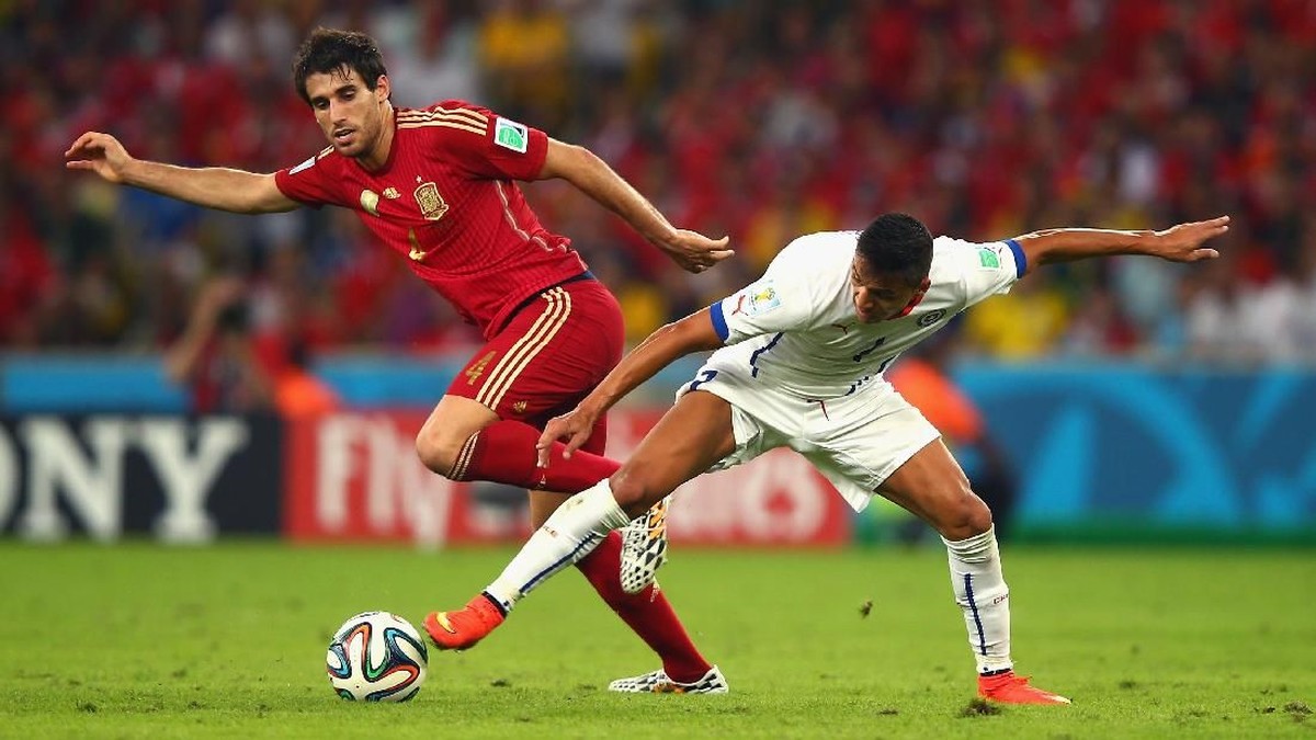 Penampilan Javi Martinez bersama timnas Spanyol di Piala Dunia 2014 (Foto: Clive Rose/Getty Images)