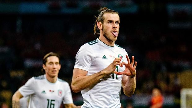 Gareth Bale merayakan gol dalam laga China vs Wales di Stadion Guangxi Sports Center, Kamis (22/3/2018).