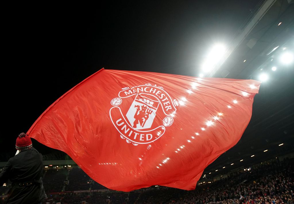 Soccer Football - Champions League Round of 16 Second Leg - Manchester United vs Sevilla - Old Trafford, Manchester, Britain - March 13, 2018   A Manchester United flag is waved before the match    REUTERS/David Klein