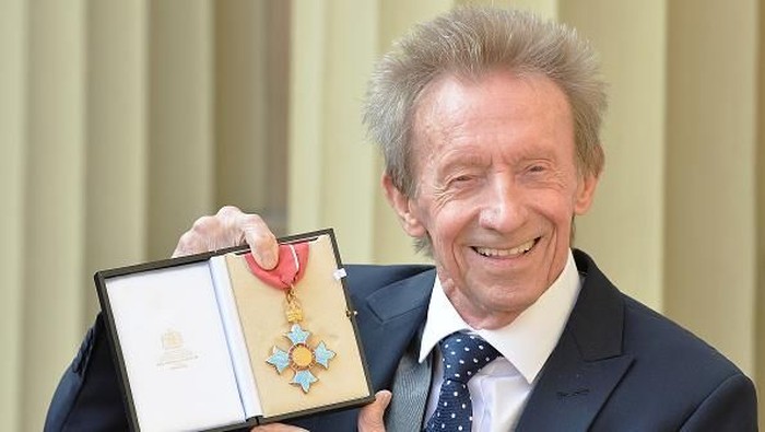 LONDON, UNITED KINGDOM - MARCH 11: Former Scotland and Manchester United footballer Denis Law poses with his Commander of the Order of the British Empire (CBE) medal that was presented to him by the Duke of Cambridge during an Investiture ceremony at Buckingham Palace on March 11, 2016 in London, United Kingdom. (Photo by John Stillwell - WPA Pool/Getty Images)