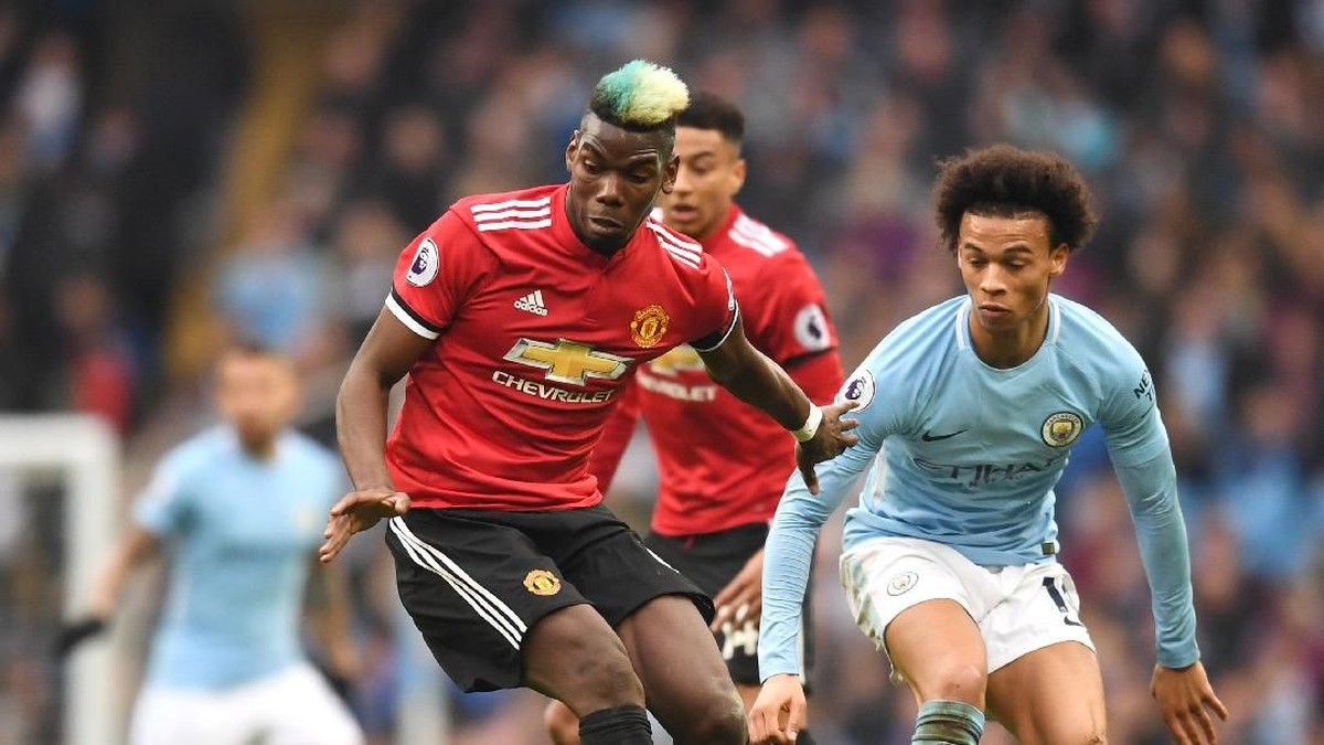 Paul Pogba dan Leroy Sane di Manchester City vs Manchester United musim lalu. (Foto: Michael Regan/Getty Images)