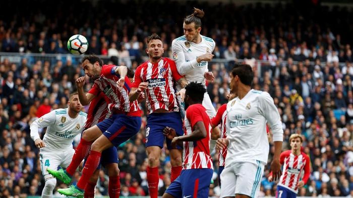 Laga derby Madrid antara Real Madrid melawan Atletico Madrid. (Foto: Sergio Perez/REUTERS) Laga derby Madrid antara Real Madrid melawan Atletico Madrid. (Foto: Sergio Perez/REUTERS)