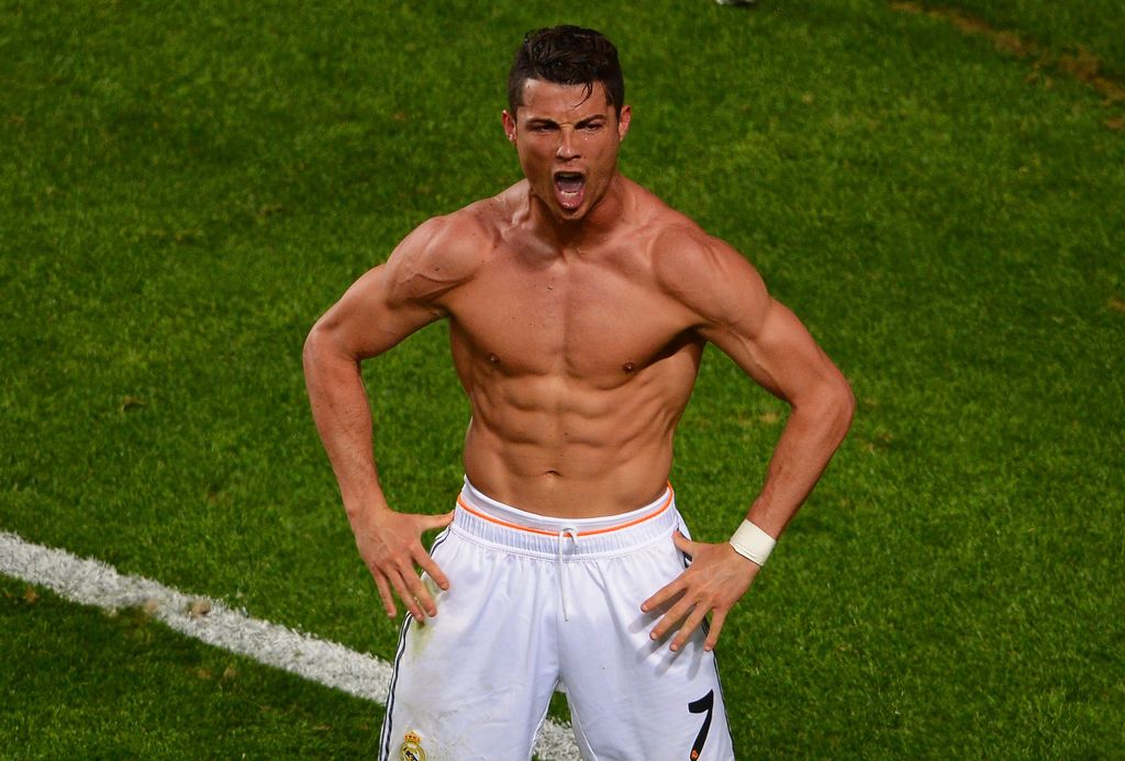 LISBON, PORTUGAL - MAY 24:  Cristiano Ronaldo of Real Madrid celebrates scoring their fourth goal from the penalty spot during the UEFA Champions League Final between Real Madrid and Atletico de Madrid at Estadio da Luz on May 24, 2014 in Lisbon, Portugal.  (Photo by Lars Baron/Getty Images)
