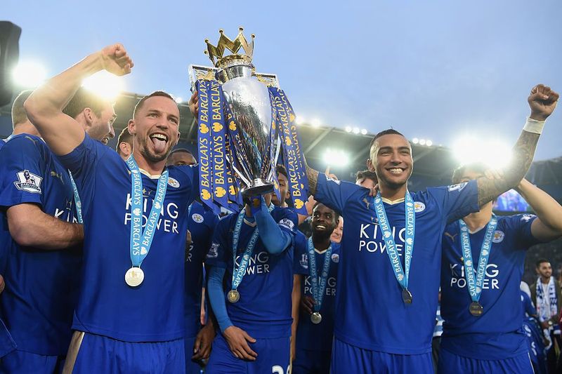Danny Drinkwater LEICESTER, ENGLAND - MAY 07: Danny Drinkwater and Danny Simpson of Leicester City poses with the Premier League Trophy as players and staffs celebrate the season champion after the Barclays Premier League match between Leicester City and Everton at The King Power Stadium on May 7, 2016 in Leicester, United Kingdom. (Photo by Michael Regan/Getty Images)