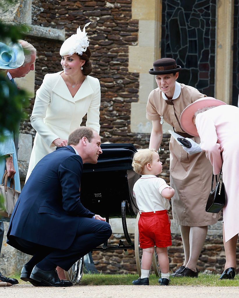 LONDON, ENGLAND - JUNE 13:  Prince George of Cambridge is held by his nanny Maria Teresa Turrion Borrallo as he waves from the window of Buckingham Palace as he watches the Trooping Tthe Colour on June 13, 2015 in London, England. The ceremony is Queen Elizabeth II's annual birthday parade and dates back to the time of Charles II in the 17th Century when the Colours of a regiment were used as a rallying point in battle.  (Photo by Chris Jackson/Getty Images)