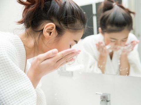 Woman wakes from sleep and she was cleansing the morning before shower