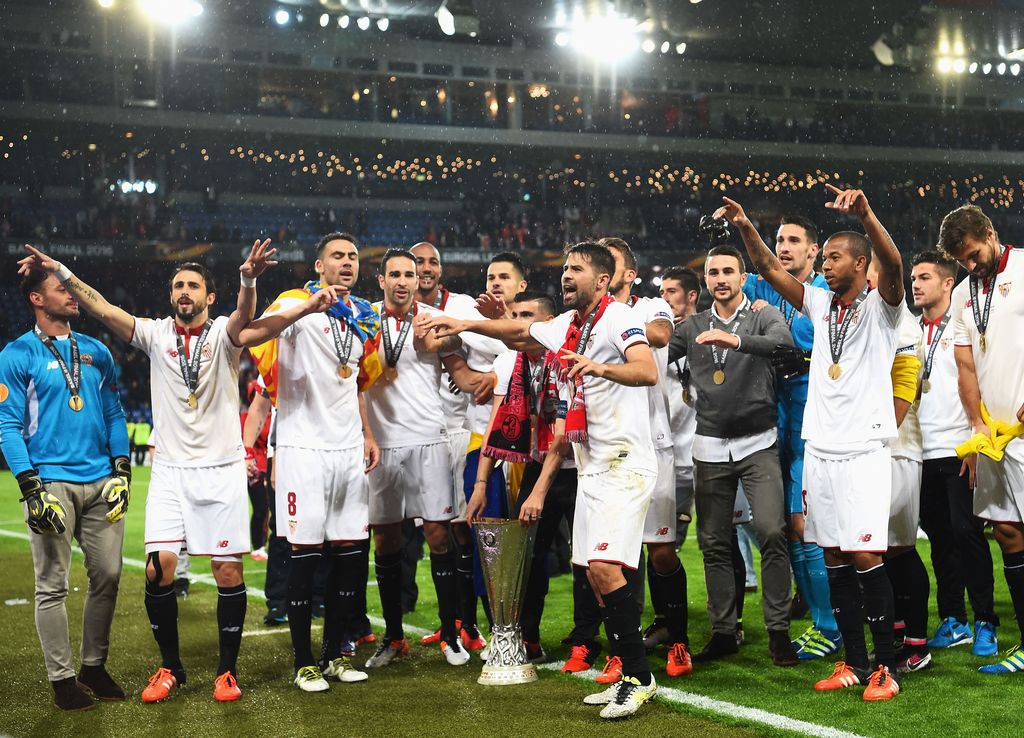 BASEL, SWITZERLAND - MAY 18:  Sevilla players celebrate the Europa League champions after the award ceremoy of the UEFA Europa League Final match between Liverpool and Sevilla at St. Jakob-Park on May 18, 2016 in Basel, Switzerland.  (Photo by Lars Baron/Getty Images)