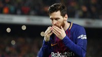 Lionel Messi merayakan golnya ke gawang Real Madrid. Barcelona masih mempertahankan rekor tak terkalahkannya musim ini. (Sergio Perez/Reuters)