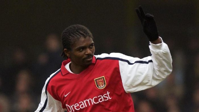 Nwankwo Kanu 5 Jan 2002: Nwankwo Kanu of Arsenal celebrates scoring the third goal during the AXA sponsored FA Cup third round match against Watford played at Vicarage Road, in Watford, England. Arsenal won the match 4-2. DIGITAL IMAGE. Mandatory Credit: Stu Forster/Getty Images