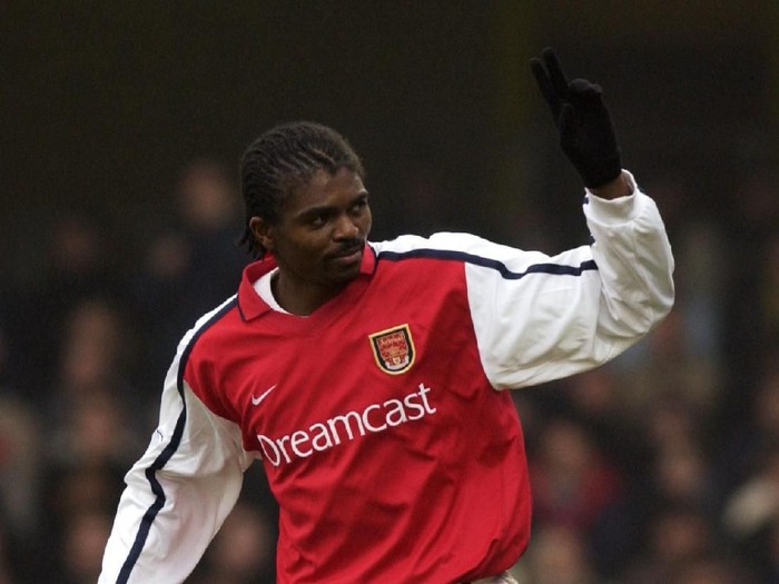 5 Jan 2002:  Nwankwo Kanu of Arsenal celebrates scoring the third goal during the AXA sponsored FA Cup third round match against Watford played at Vicarage Road, in Watford, England. Arsenal won the match 4-2. DIGITAL IMAGE. Mandatory Credit: Stu Forster/Getty Images