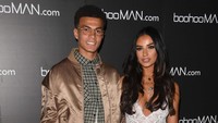 Alli tak datang sendiri dalam acara tersebut. Dia didampingi seorang perempuan berambut hitam. Dia Ruby Mae.  (Stuart C. Wilson/Getty Images)