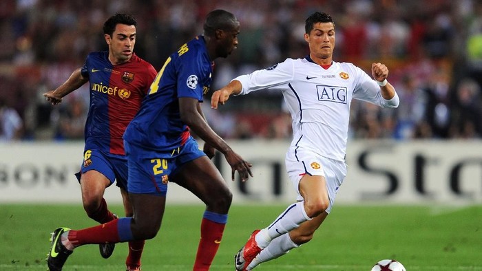 ROME - MAY 27:  Cristiano Ronaldo of Manchester United battles for the ball with Yaya Toure and Xavi of Barcelona during the UEFA Champions League Final match between Barcelona and Manchester United at the Stadio Olimpico on May 27, 2009 in Rome, Italy.  (Photo by Jasper Juinen/Getty Images)
