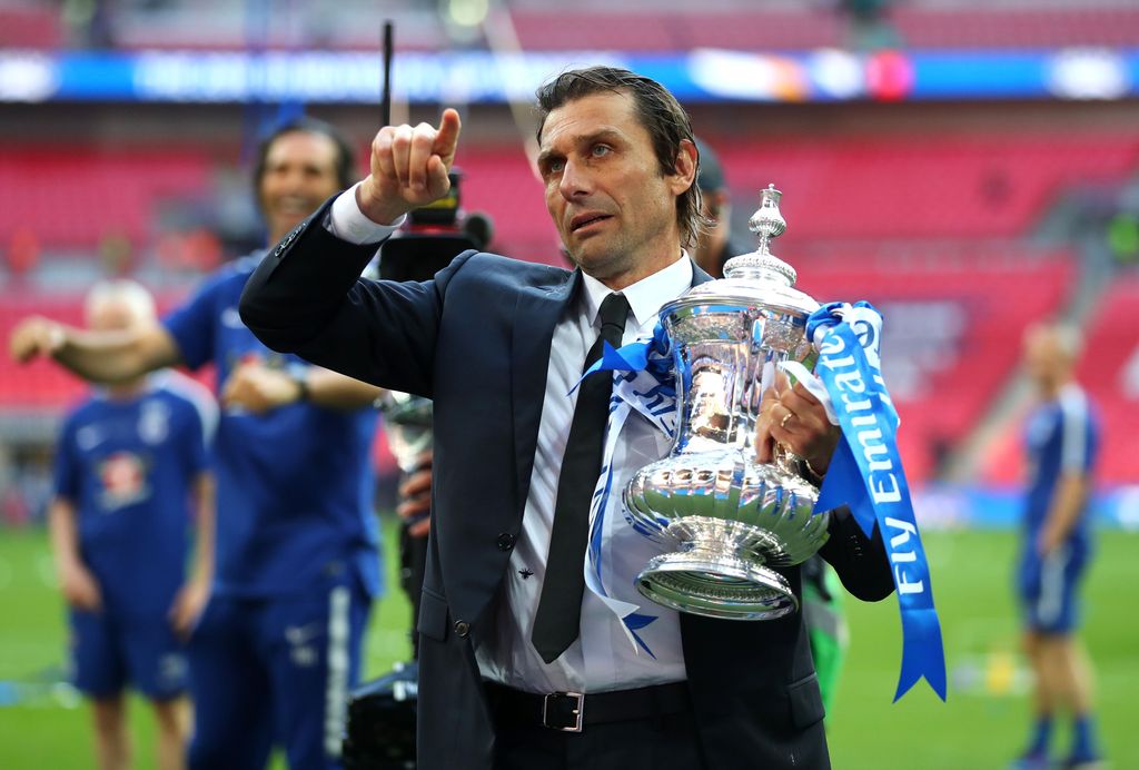 Antonio Conte LONDON, ENGLAND - MAY 19: Antonio Conte, Manager of Chelsea holds the Emirates FA Cup trophy following his side's win during The Emirates FA Cup Final between Chelsea and Manchester United at Wembley Stadium on May 19, 2018 in London, England. (Photo by Catherine Ivill/Getty Images)