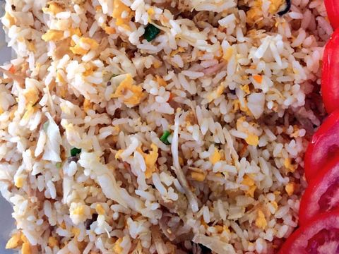 Soy sauce fried rice served in porcelain plate