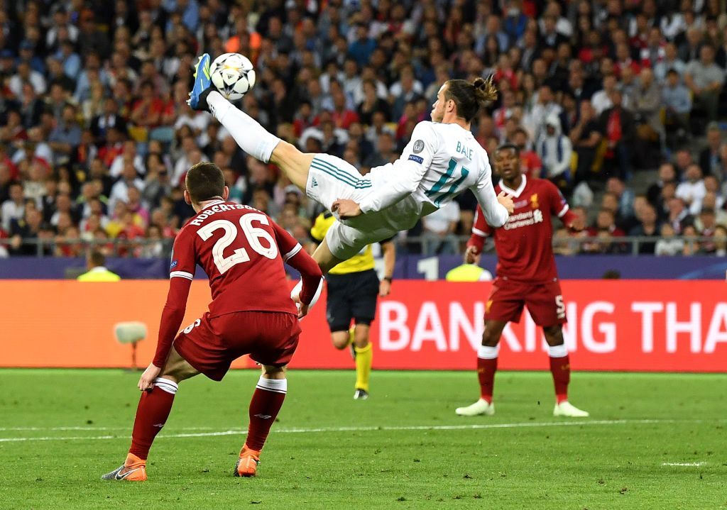 KIEV, UKRAINE - MAY 26:  Gareth Bale of Real Madrid shoots and scores his side's second goal during the UEFA Champions League Final between Real Madrid and Liverpool at NSC Olimpiyskiy Stadium on May 26, 2018 in Kiev, Ukraine.  (Photo by David Ramos/Getty Images)