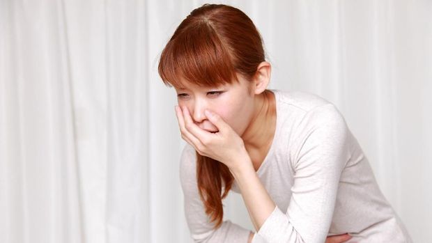 Young vomiting woman portrait. Pregnant blonde suffering with nausea. Pregnancy symptoms, gestosis, parenthood concept
