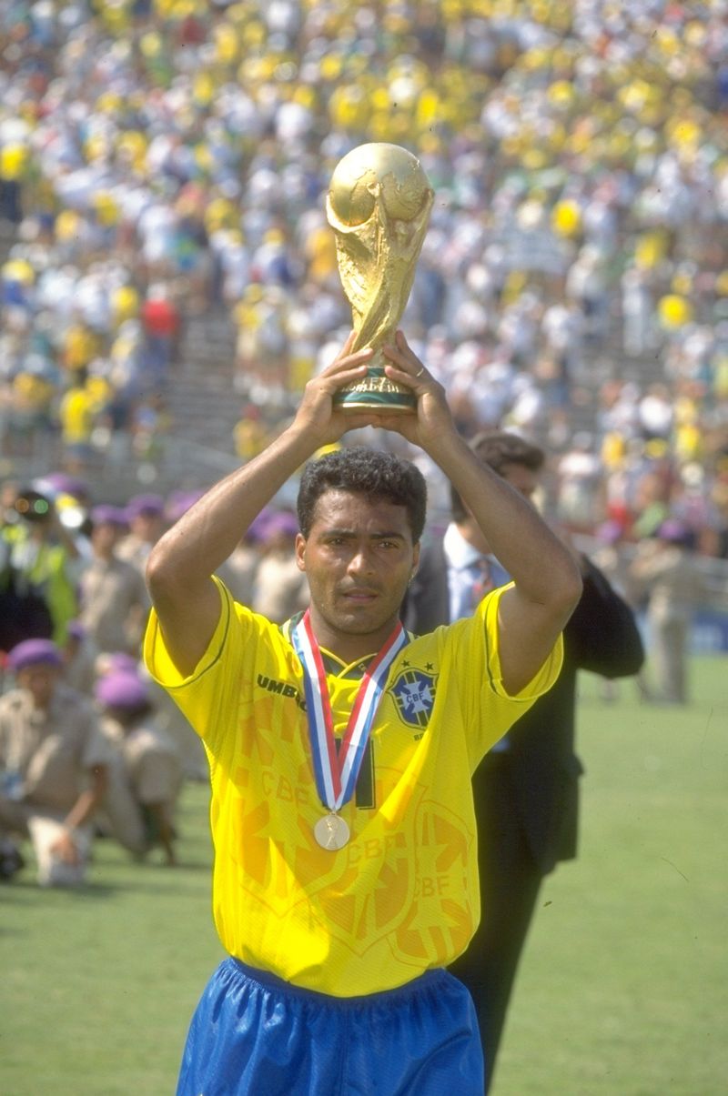 17 Jul 1994: Romario of Brazil holds the trophy aloft after the World Cup final against Italy at the Rose Bowl in Los Angeles, California, USA. Brazil won the match 3-2 on penalties. Mandatory Credit: Simon Bruty/Allsport