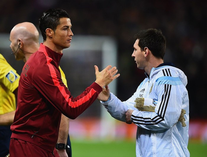 MANCHESTER, ENGLAND - NOVEMBER 18:  Cristiano Ronaldo of Portugal shakes hands with Lionel Messi of Argentina prior to the International Friendly between Argentina and Portugal at Old Trafford on November 18, 2014 in Manchester, England.  (Photo by Laurence Griffiths/Getty Images)