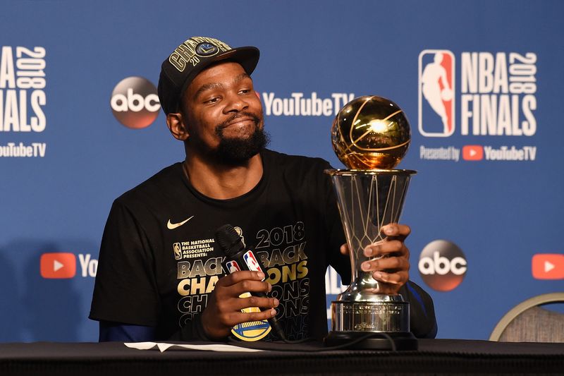 CLEVELAND, OH - JUNE 08:  Finals MVP Kevin Durant #35 of the Golden State Warriors speaks to the media after defeating the Cleveland Cavaliers during Game Four of the 2018 NBA Finals at Quicken Loans Arena on June 8, 2018 in Cleveland, Ohio. The Warriors defeated the Cavaliers 108-85 to win the 2018 NBA Finals.  NOTE TO USER: User expressly acknowledges and agrees that, by downloading and or using this photograph, User is consenting to the terms and conditions of the Getty Images License Agreement.  (Photo by Jason Miller/Getty Images)