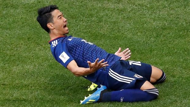 Shinji Kagawa mencetak gol keunggulan Jepang lewat titik putih.