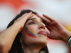 Kekalahan Kolombia dari Jepang membuat para suporter mereka patah hati. Foto: Ricardo Moraes/Reuters