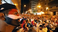 Kesedihan itu menular ke para pendukung Mesir yang sedang nonton bareng di Kairo. Raut kekecewaan terlihat di wajah mereka. (Foto: Mohamed Abd El Ghany)
