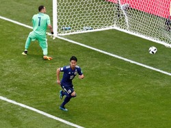 Jepang memimpin 1-0 setelah Shinji Kagawa sukses memaksimalkan hadiah penalti menjadi gol. Reuters/Damir Sagolj.