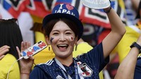 Kalau yang ini suporter cantik dari Jepang. Foto: Carl Court/Getty Images