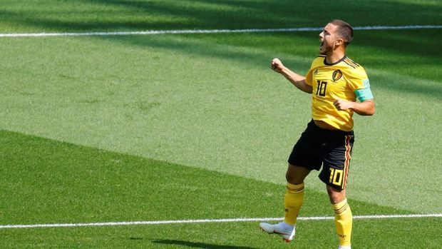 Eden Hazard merayakan gol ke gawang Tunisia.