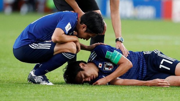 Timnas Jepang berusaha keras dalam laga lawan Senegal.