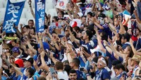 Fans Jepang terus memberikan dukungan kepada tim kesayangannya. Reuters/Jorge Silva.