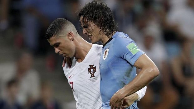Edinson Cavani berhasil mencetak dua gol untuk membawa Uruguay menang atas Portugal.