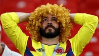 Raut kesedihan terlihat jelas di wajah suporter Kolombia. Reuters/Carl Recine.
