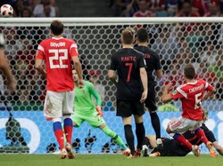 Rusia lebih dulu memimpin lewat gol Denis Cheryshev di menit ke-31. (Foto: Henry Romero/Reuters)