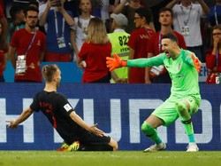 Pada prosesnya, Kroasia yang keluar sebagai pemenang setelah tembakan Ivan Rakitic gagal dihentikan kiper Rusia. (Foto: Kai Pfaffenbach/Reuters)