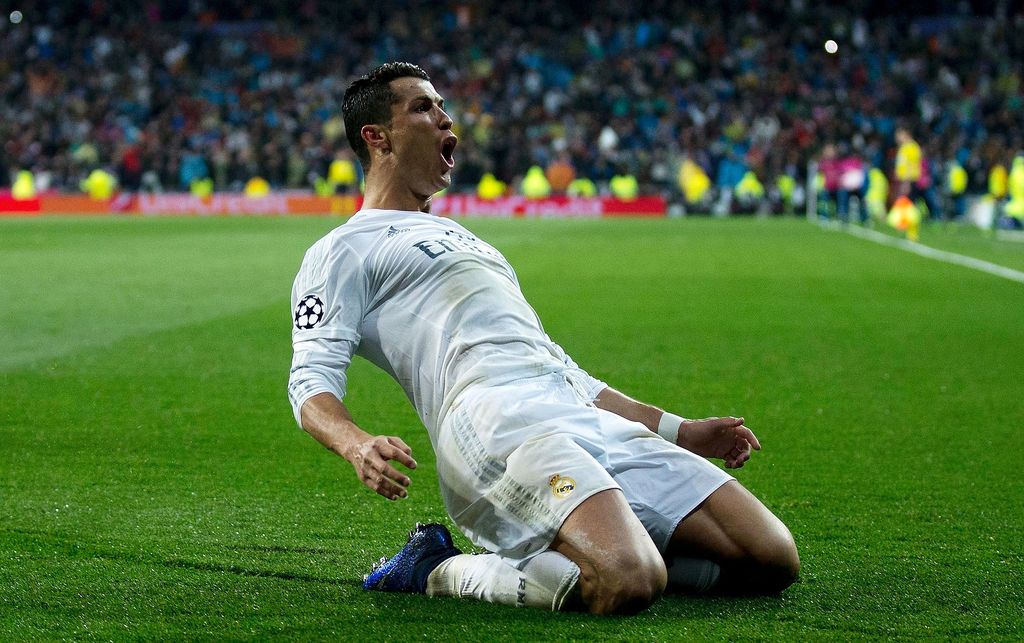 MADRID, SPAIN - APRIL 12:  Cristiano Ronaldo of Real Madrid celebrates as he scores their third goal from a free kick and completes his hat trick during the UEFA Champions League quarter final second leg match between Real Madrid CF and VfL Wolfsburg at Estadio Santiago Bernabeu on April 12, 2016 in Madrid, Spain.  (Photo by Gonzalo Arroyo Moreno/Getty Images)