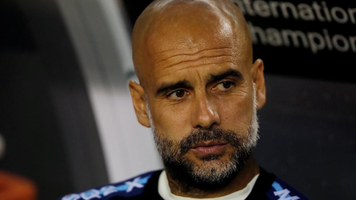 Pep Guardiola tetap puas meski Manchester City kalah dari Borussia Dortmund (Foto: John Gress/Reuters)