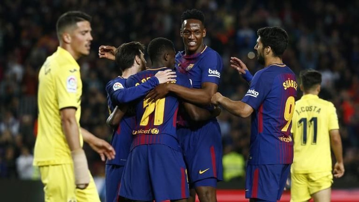Yerry Mina mengungkap kisahnya kalah taruhan dari Luis Suarez dan Lionel Messi di Barcelona (Foto: PAU BARRENA/AFP)