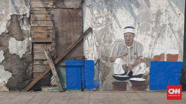 Mural bertema penjual kerak telor.