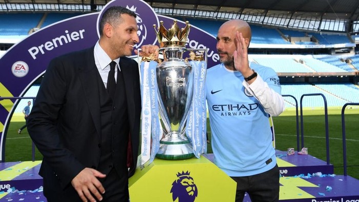 MANCHESTER, ENGLAND - MAY 06:  Khaldoon al-Mubarak, Manchester City chairman and Josep Guardiola, Manager of Manchester City pose with the Premier League trophy as Manchester City win the Premier League after the Premier League match between Manchester City and Huddersfield Town at Etihad Stadium on May 6, 2018 in Manchester, England.  (Photo by Michael Regan/Getty Images)