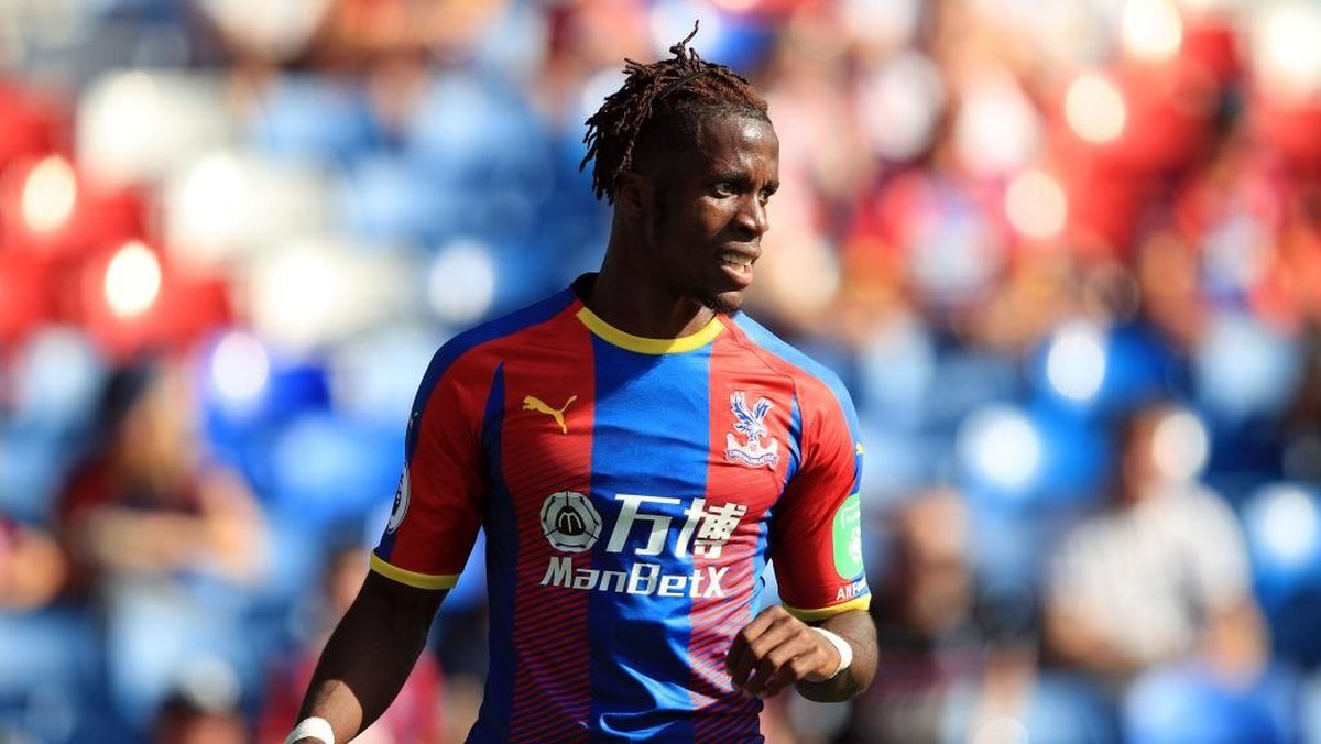 Wilfried Zaha tak tahu apa-apa soal rumor ke Arsenal. (Foto: Marc Atkins/Getty Images)