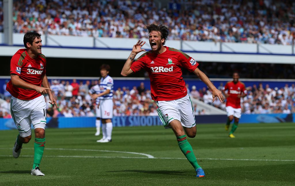 LONDON, ENGLAND - AUGUST 18:  Michu of Swansea celebrates scoring the opening goal during the Barclays Premier League match between Queens Park Rangers and Swansea City at Loftus Road on August 18, 2012 in London, England.  (Photo by Richard Heathcote/Getty Images)