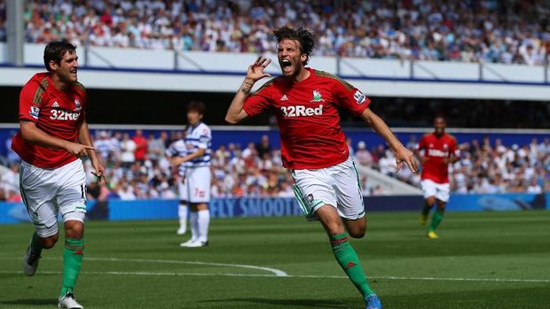 LONDON, ENGLAND - AUGUST 18:  Michu of Swansea celebrates scoring the opening goal during the Barclays Premier League match between Queens Park Rangers and Swansea City at Loftus Road on August 18, 2012 in London, England.  (Photo by Richard Heathcote/Getty Images)