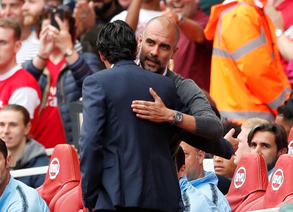 Soccer Football - Premier League - Arsenal v Manchester City - Emirates Stadium, London, Britain - August 12, 2018   Manchester City manager Pep Guardiola and Arsenal manager Unai Emery before the match   Action Images via Reuters/John Sibley    EDITORIAL USE ONLY. No use with unauthorized audio, video, data, fixture lists, club/league logos or 