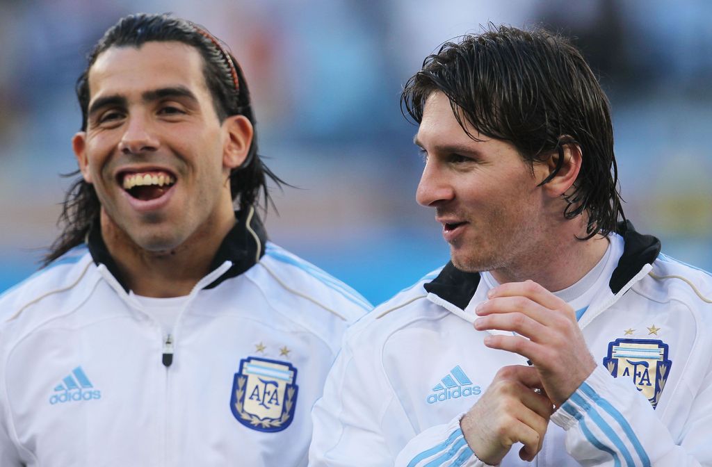 CAPE TOWN, SOUTH AFRICA - JULY 03:  Carlos Tevez and Lionel Messi of Argentina share a joke ahead of the 2010 FIFA World Cup South Africa Quarter Final match between Argentina and Germany at Green Point Stadium on July 3, 2010 in Cape Town, South Africa.  (Photo by Chris McGrath/Getty Images)