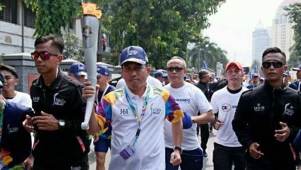 Askrindo Meriahkan Kirab Obor Asian Games